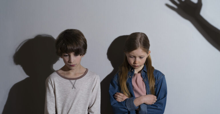 young-child-suffering-abuse-with-shadow