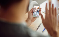 Close-up of African American doctor greeting his patient during