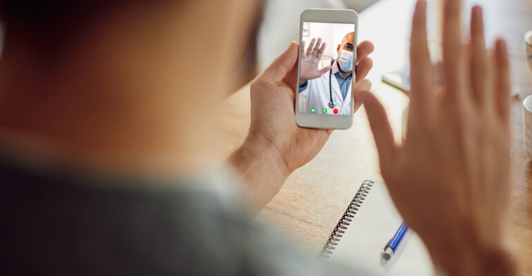Close-up of African American doctor greeting his patient during