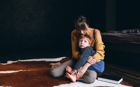 Mother with her son playing in the room