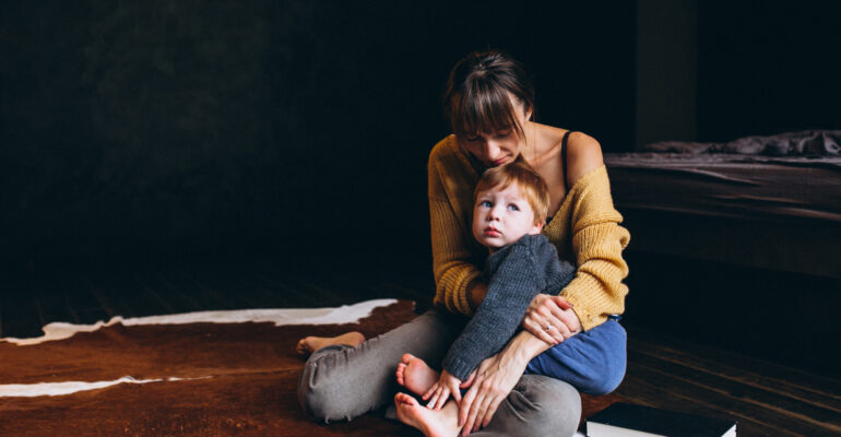 Mother with her son playing in the room