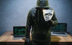 hacker-holding-mask