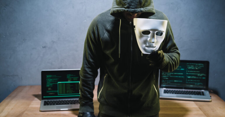 hacker-holding-mask