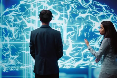 Engineers use VR headset and AR hologram, looking at AI neural networks